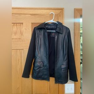 Black leather jacket with polyester/lycra sleeves by Oscar Leopold
